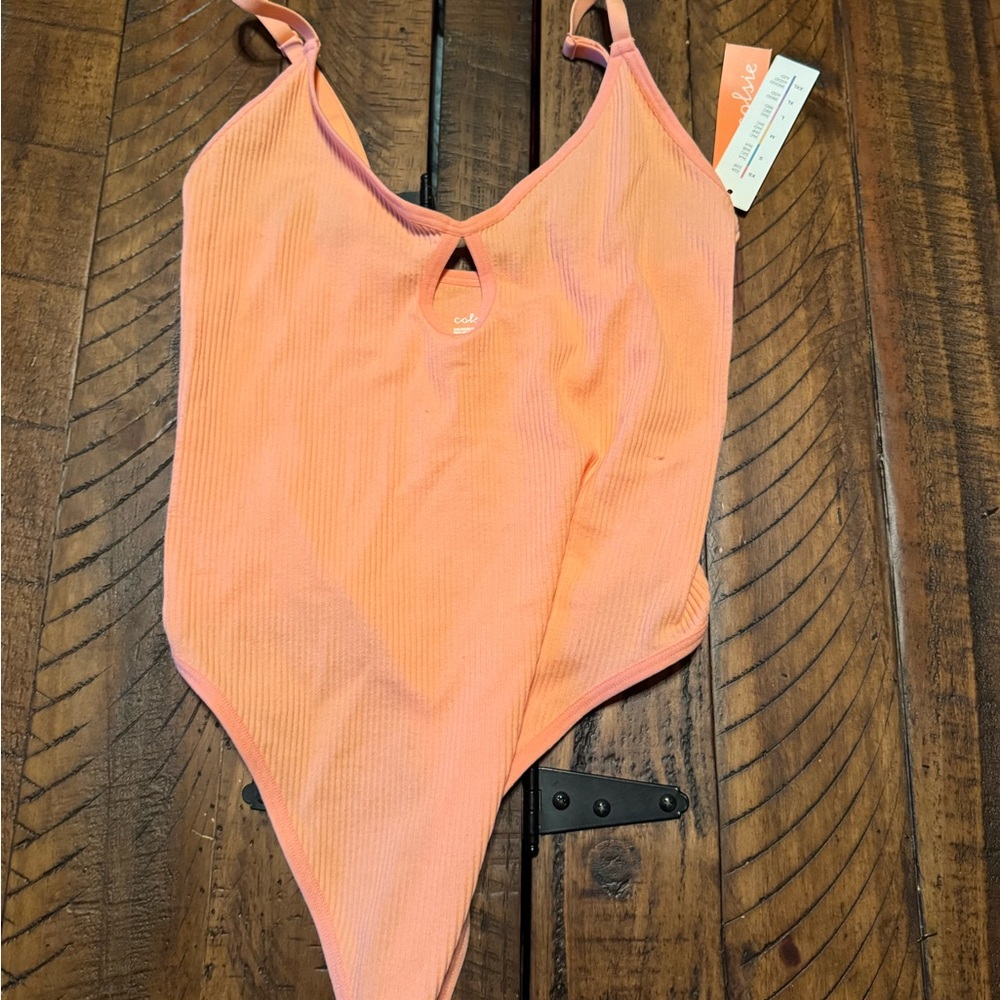 Orange/ Peach body suit size xs brand new